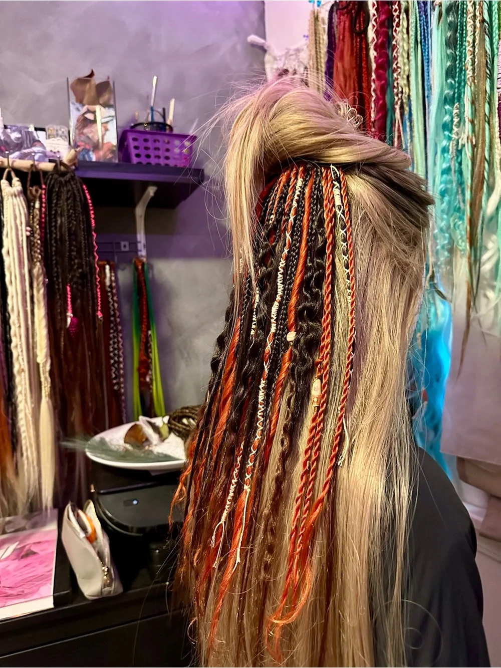 Blonde Hair Extensions with Black and Orange Braided Accents